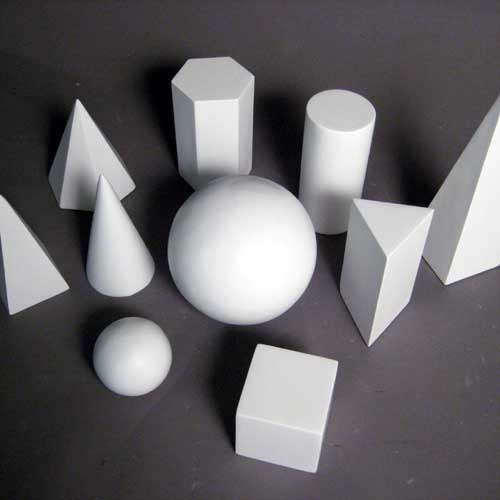 Geometric forms arranged in a group, featuring spheres, cubes, cones, pyramids, and cylinders in a classical study composition. Side View