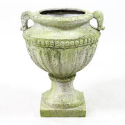 Ornate old world European urn planter with fluted bowl and classical pedestal base, featuring carved Baroque-style details. Different Angle