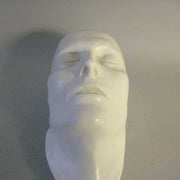 Classical European sculpted head with closed eyes, smooth features, and serene expression, evoking Renaissance and old world style. Side Angle