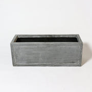 Rectangular planter box with clean lines and subtle classical detailing, evoking an old world European architectural style. Side Angle