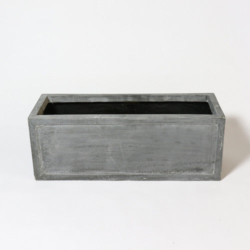 Rectangular planter box with clean lines and subtle classical detailing, evoking an old world European architectural style. Side Angle