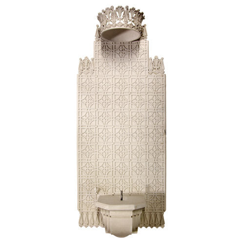 Ornate Gothic wall fountain with intricate geometric patterns, pointed arches, and a decorative crown-like top.