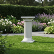 Classical Greek fluted pedestal column with ornate base and capital, featuring symmetrical vertical grooves and architectural detailing. Side Angle