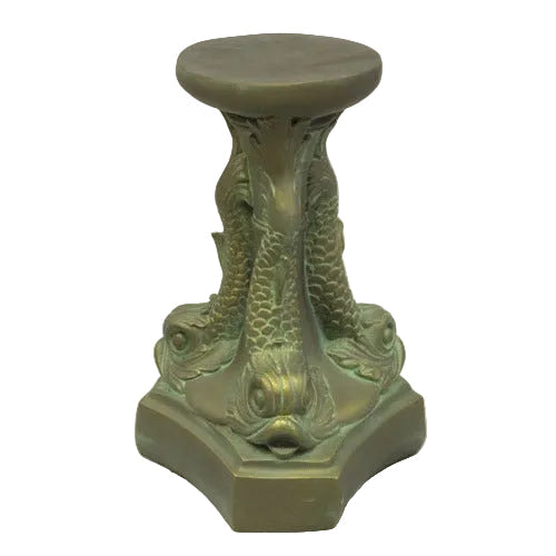 Ornate pedestal with three sculpted fish in classical old world European style, featuring intricate scales and Baroque detailing.