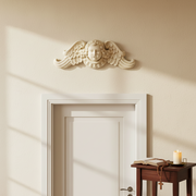 Cherub face with curled hair and ornate wings in classical Baroque style, featuring intricate old world European detailing. Side Angle