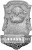 Ornate old world European wall fountain with classical lion head spout, Baroque scrollwork, and decorative architectural details