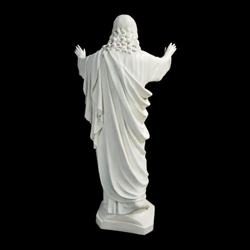 Jesus statue with outstretched arms, classical Renaissance style, ornate detailing, flowing robes, sacred heart motif on chest. Other Angle