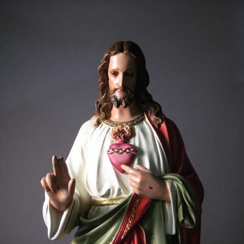 Sacred Heart of Jesus statue in classical Renaissance style, featuring ornate robes and detailed facial expression, standing on a pedestal. Side Angle View