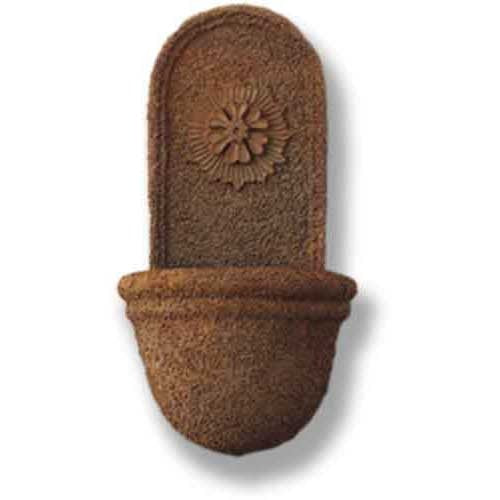 Ornate old world European wall fountain with classical floral medallion and textured, arched backplate.