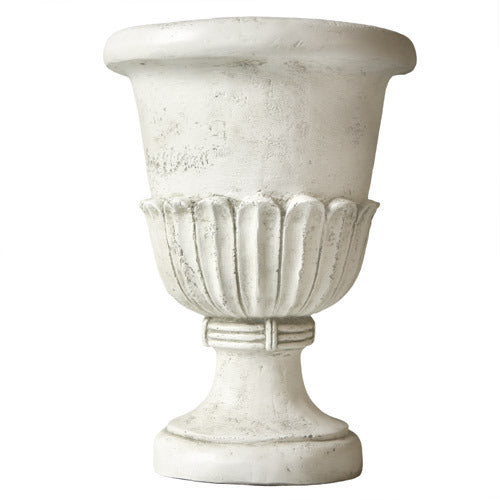 Classical urn planter with fluted detailing and ornate pedestal base, inspired by old world European and Renaissance design.