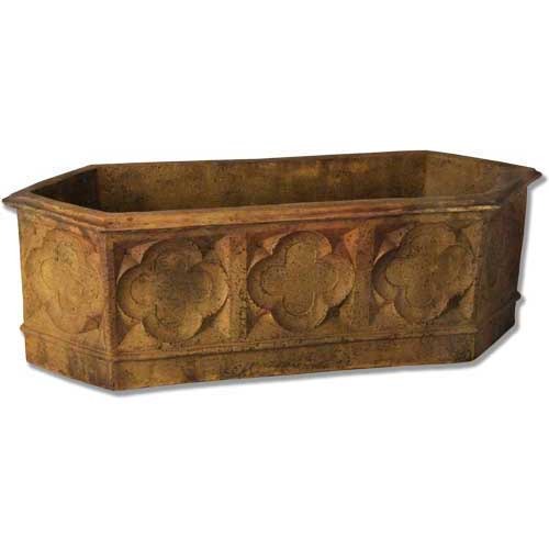 Octagonal planter with ornate Gothic quatrefoil motifs and old world European architectural detailing.