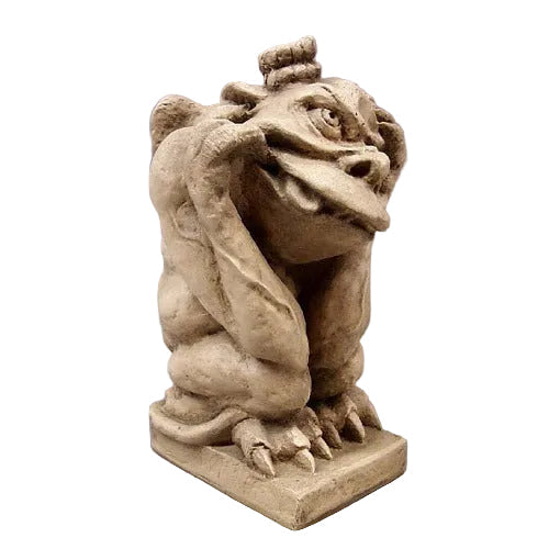 Gargoyle statue with exaggerated features, crouching pose, and ornate medieval Gothic style detailing.
