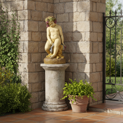 Cherub statue in classical Renaissance style, seated on a rock with grapevine wreath and draped cloth, featuring ornate detailing. Side Angle