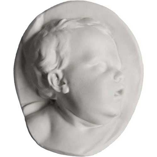 Classical Baroque-style cherub relief with delicate facial features and softly sculpted hair in an ornate, old world European design.