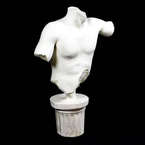 Classical Greek male torso sculpture with missing head and arms, displayed on an ornate fluted pedestal in old world European style. Other Angle