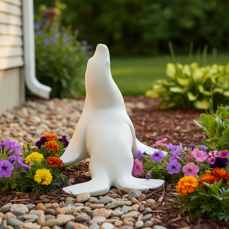 Seal figurine with smooth, minimalist lines and subtle classical detailing, evoking a serene, old world European aesthetic. Side Angle