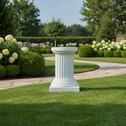 Classical Greek fluted column pedestal with ornate base and simple round capital, evoking old world European architectural style. Side Angle
