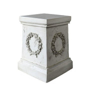 Square pedestal with ornate classical wreath relief, featuring old world European and Baroque-inspired architectural detailing. Different Angle