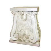 Ornate pedestal with classical scrollwork, textured surface, and old world European Baroque-inspired decorative details.