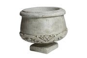 Ornate old world European planter with classical carved scrollwork and pedestal base, featuring a rounded bowl shape. Side View