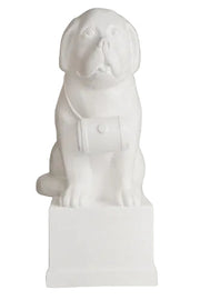 St. Bernard dog statue with barrel collar, seated on a pedestal in classical European style with subtle ornate detailing. Side View