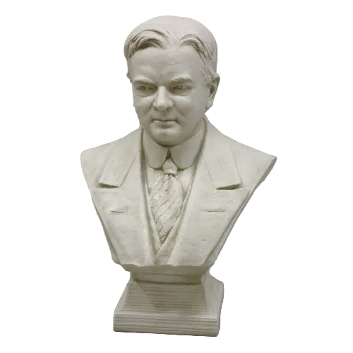 Classical European bust sculpture featuring a man in a suit and tie with detailed, realistic facial features and an ornate base.