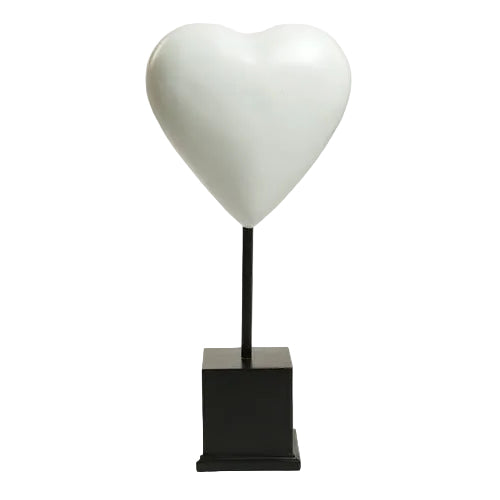 Heart-shaped sculpture on a square pedestal stand, featuring smooth, minimalist lines with a classical European influence. Side View