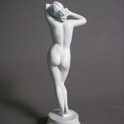 Classical female torso sculpture with raised arms, inspired by Renaissance and Greek art, featuring smooth, elegant contours. Side Angle