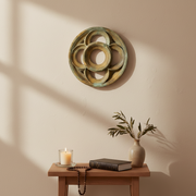Ornate round medallion with interlocking rings, featuring old world European and Gothic architectural detailing. Different Angle