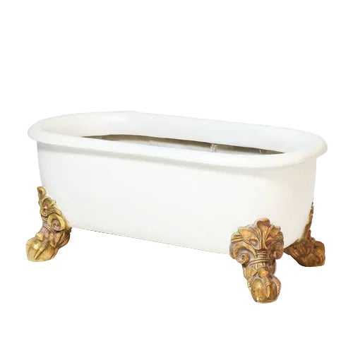 Clawfoot bathtub with ornate, Baroque-style gold feet and classical old world European design. Side View