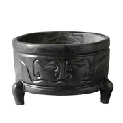 Tripod incense burner with ornate, old world European motifs and classical curved patterns, featuring three sturdy legs and raised reliefs. Side Angle