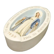 Virgin Mary statue in classical old world European style, set in an ornate oval frame with inscribed prayer and the year 1830.