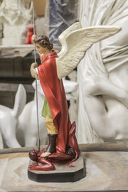 Archangel with flowing cape and ornate armor in classical style, standing over a dragon, holding a spear in dramatic pose. Side Angle