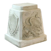 Pedestal with classical old world European style, featuring an ornate eagle relief and shield with laurel motif in bas-relief.