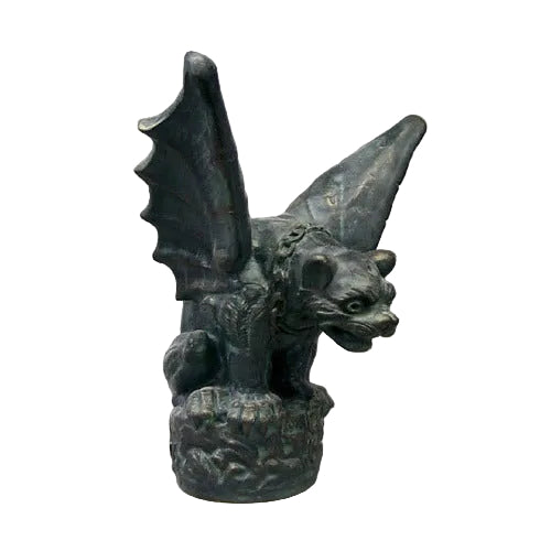 Gothic gargoyle statue with bat-like wings, fierce expression, and ornate detailing in old world European medieval style.