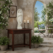 Angel statue with flowing robes and wings, holding lilies, featuring ornate, old world European and classical design elements. Side Angle