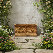 Rectangular planter with ornate Baroque relief featuring cherubs and classical motifs in an old world European style. Side Angle