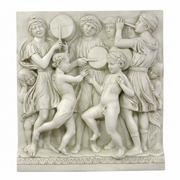 Classical Renaissance relief sculpture depicting dancing children and adults in flowing robes with ornate, old world European detailing. Side View