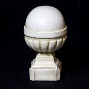 Ornate old world European finials with classical fluted bases and spherical tops in varying sizes, featuring architectural detailing. Different Angle