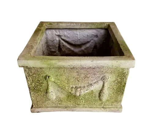 Square planter with ornate old world European detailing, featuring classical garland relief and weathered, aged finish.