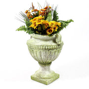 Ornate old world European urn planter with fluted bowl and classical pedestal base, featuring carved Baroque-style details. Side Angle