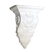 Ornate classical wall corbel with intricate Baroque floral carvings and old world European architectural detailing. Side View