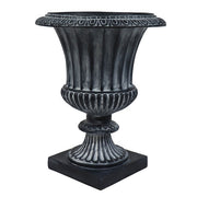 Ornate classical urn planter with fluted body, decorative rim, and pedestal base in old world European style. Side Angle