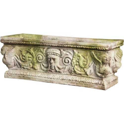 Ornate rectangular planter with classical Baroque reliefs, featuring faces, scrollwork, and winged figures in old world European style.