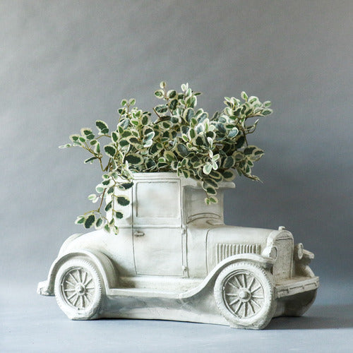 Vintage car sculpture with old world European charm, featuring ornate classical detailing and a nostalgic, early 20th-century design. Other Angle