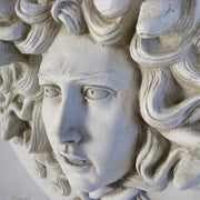 Medusa head relief with intricate serpentine hair, classical Greek style, ornate detailing, and dramatic facial expression. Other Angle