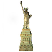 Statue of Liberty replica with classical draped robe, ornate crown, and raised torch in neoclassical architectural style. Different Angle