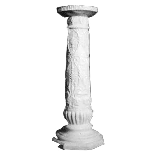 Ornate classical pedestal with intricate Baroque floral carvings and fluted details in old world European style.