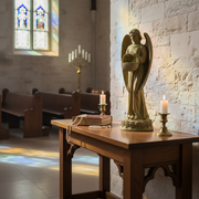 Angel statue with outstretched wings holding a bowl, featuring ornate, old world European and Gothic detailing on a decorative base. Side Angle