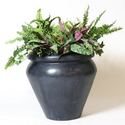 Classical European urn planter with a rounded lip and tapered body, featuring a smooth, minimalist old world silhouette. Side Angle